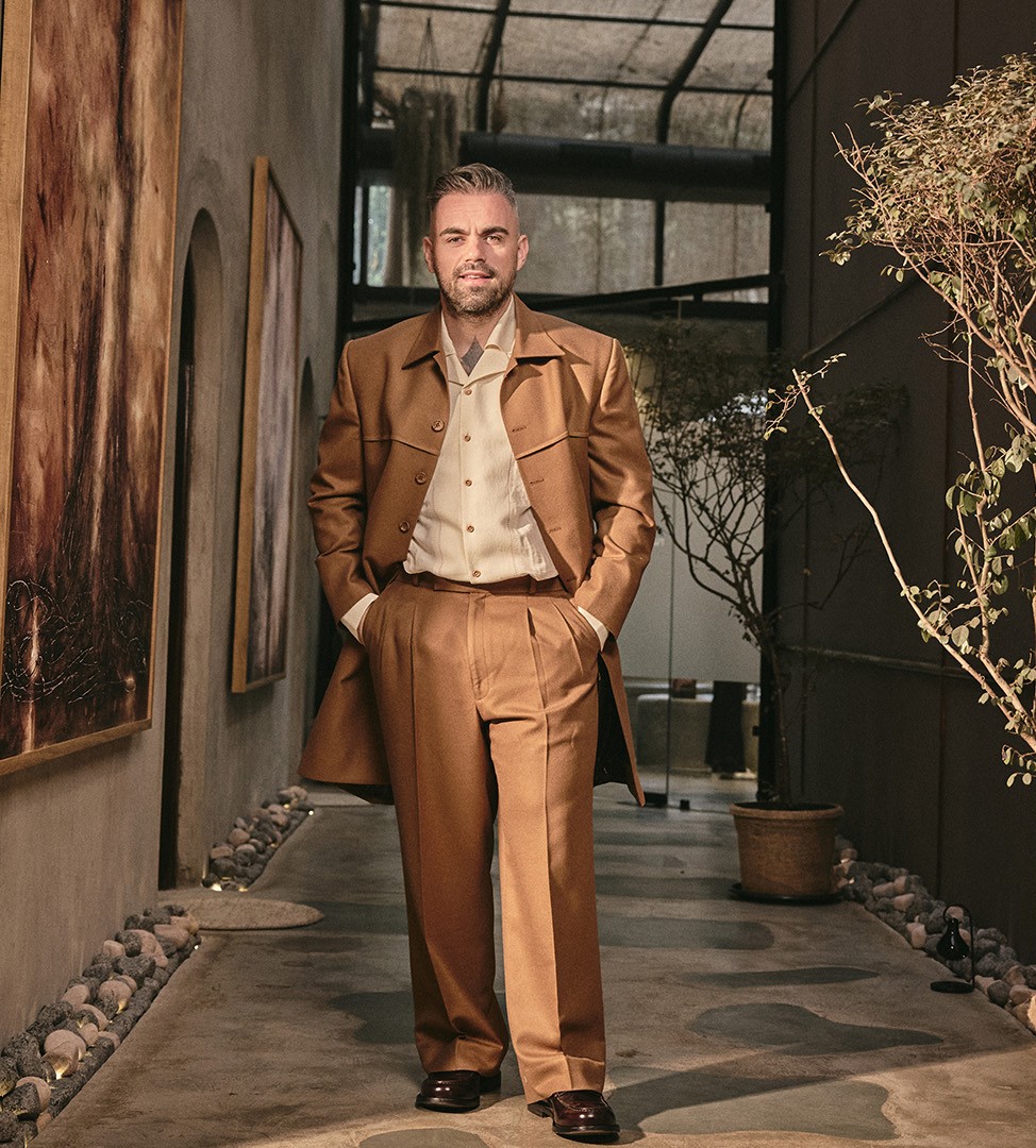 Florian Hurel styling model's hair during professional outdoor fashion shoot